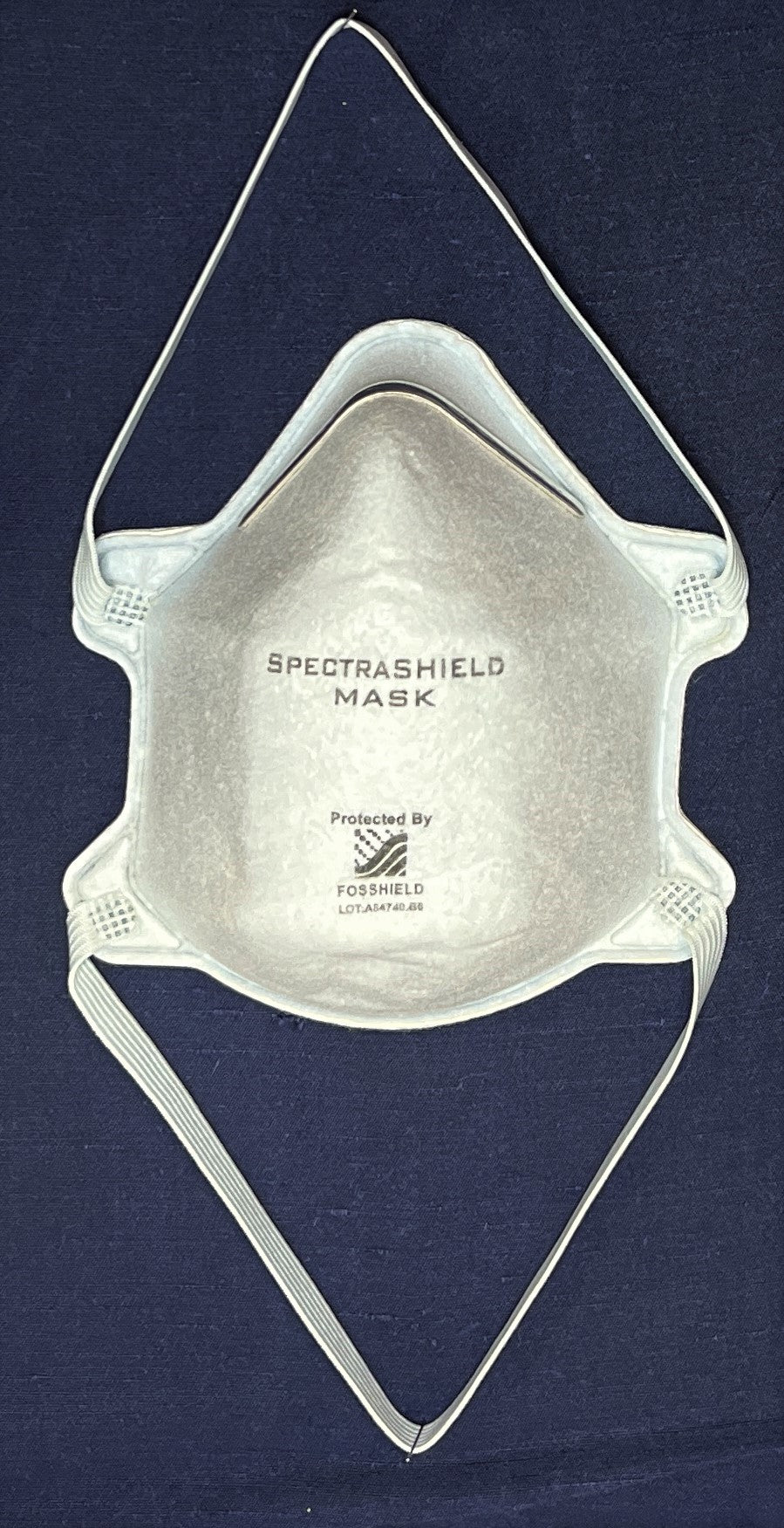 The reusable N99 SpectraShield mask against a blue background.